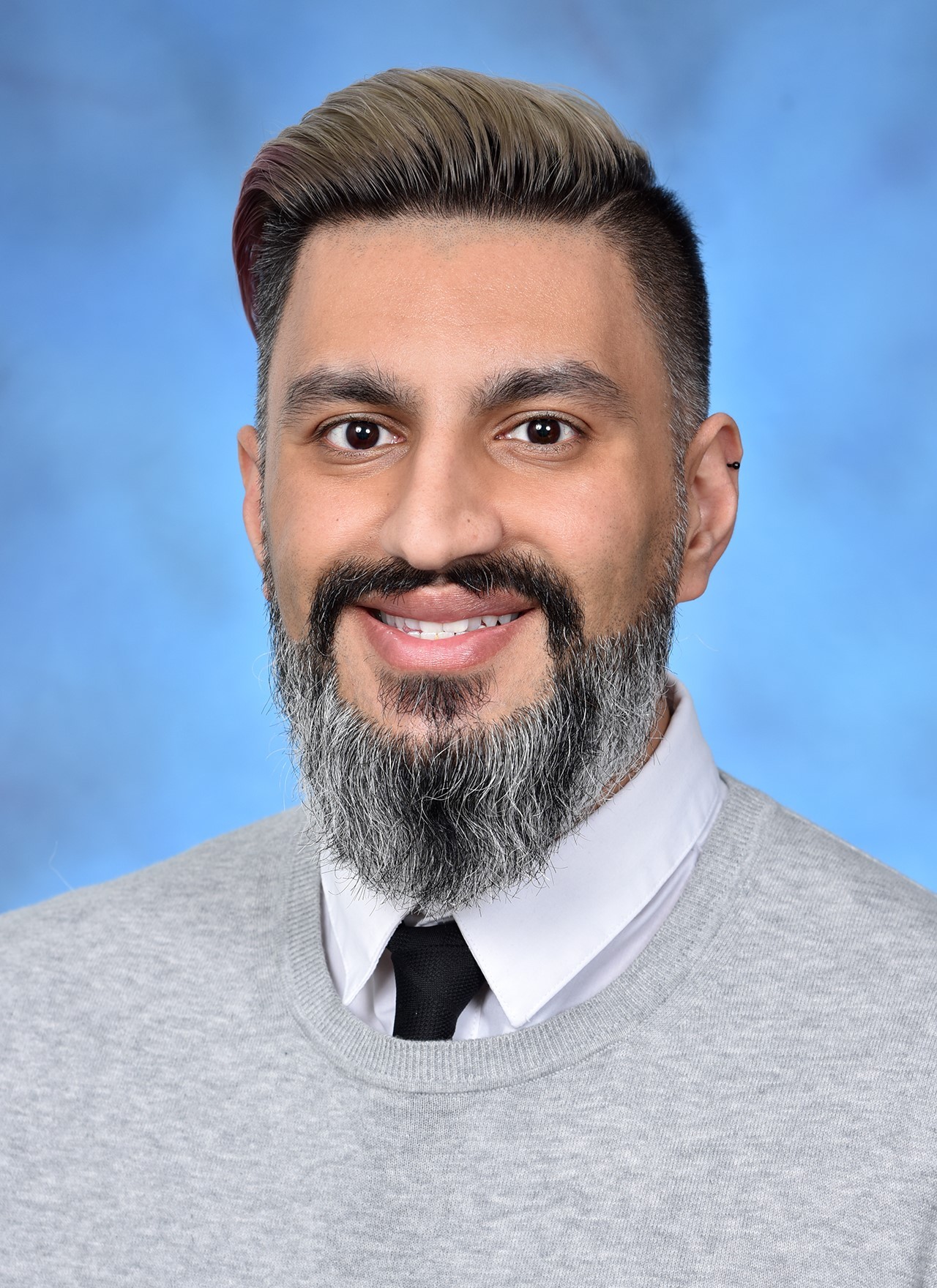 Dr. Sulman Aziz Mirza, studio headshot